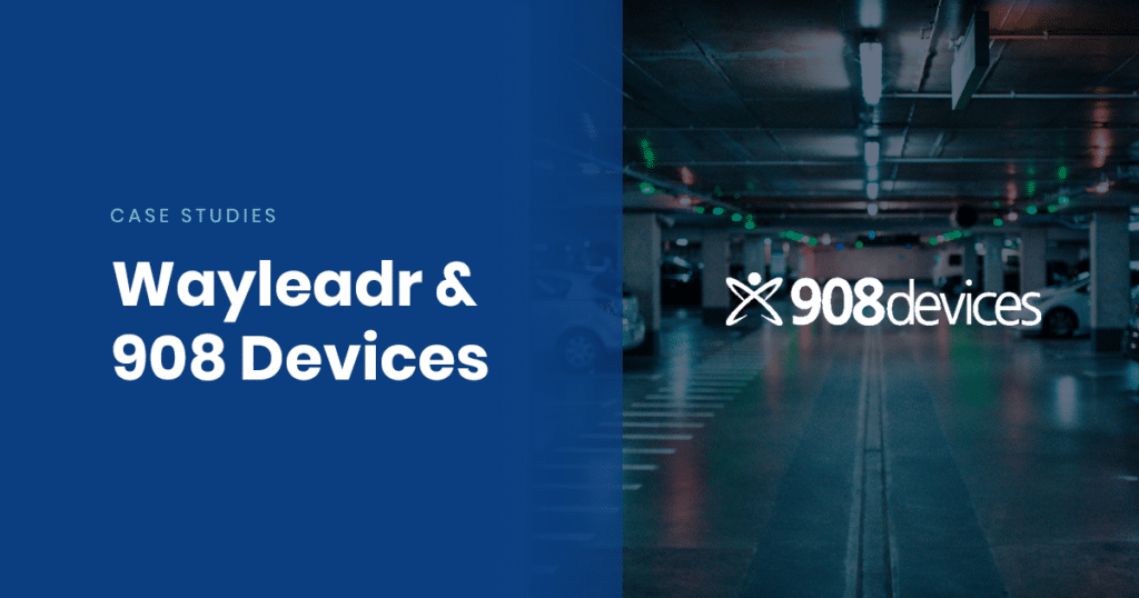 Text reads "Case Studies: Wayleadr & 908 Devices" on the left side over a blue background. On the right side is a parking garage with the 908 Devices logo centered and illuminated, showcasing innovative parking lot management solutions by Wayleadr.