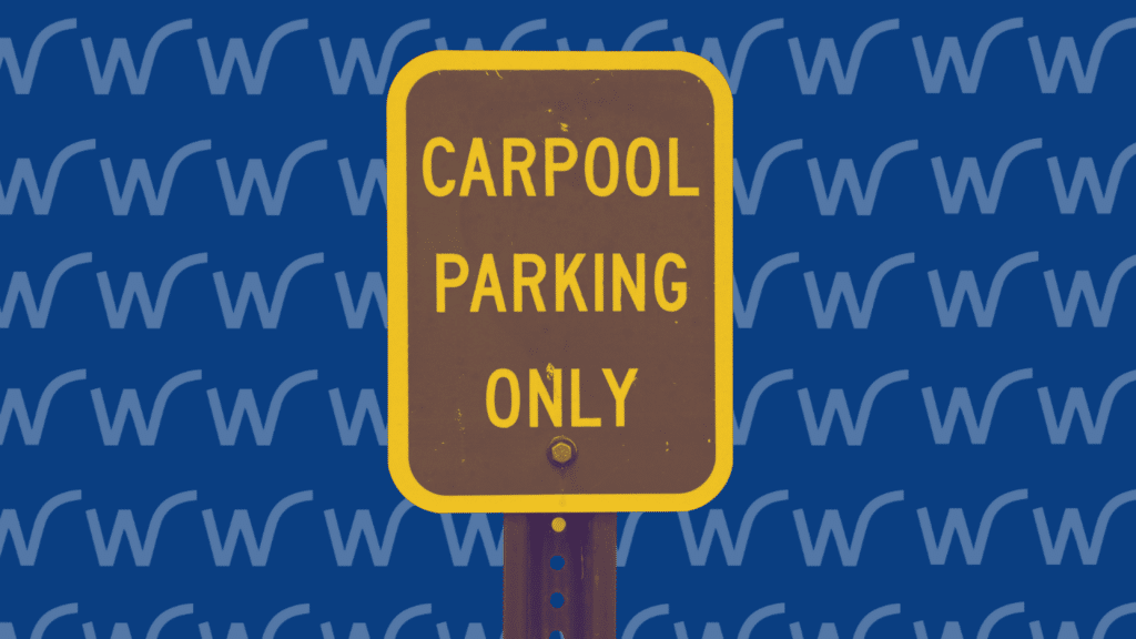 A sign with a yellow border reads "Carpool Parking Only" against a background with repetitive blue and white "W" patterns, showcasing an organized parking management system.