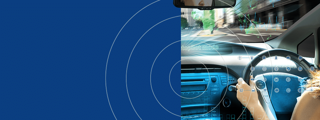 A person's hands on a steering wheel with a semi-transparent overlay depicting augmented reality navigation elements of a car's dashboard. The background shows an urban environment, highlighting features essential for commercial parking and parking lot management with Wayleadr technology.