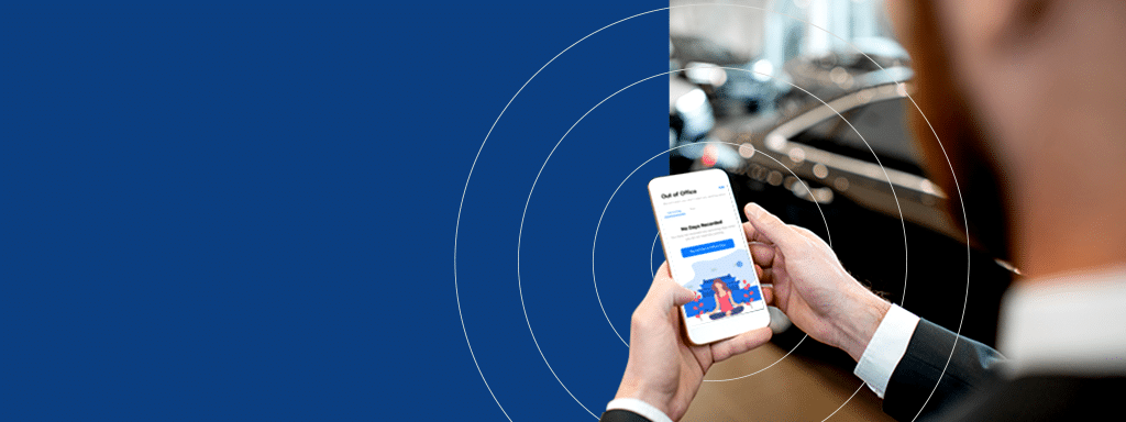 A person in a suit is holding a smartphone displaying a login screen, with the background showing a blurred car and a blue area with circular patterns, highlighting the seamless integration of parking management technology.