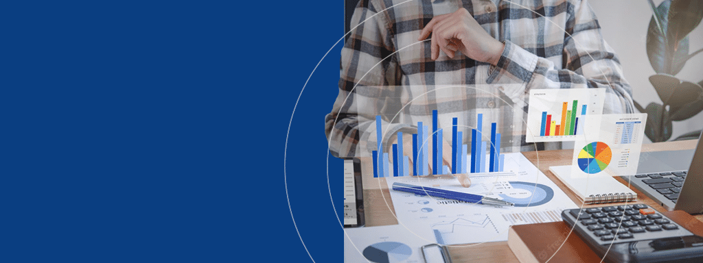 Person analyzing bar and pie charts on paper and laptop at a desk with a calculator, notepad, and pen, while also reviewing parking management data from Wayleadr.