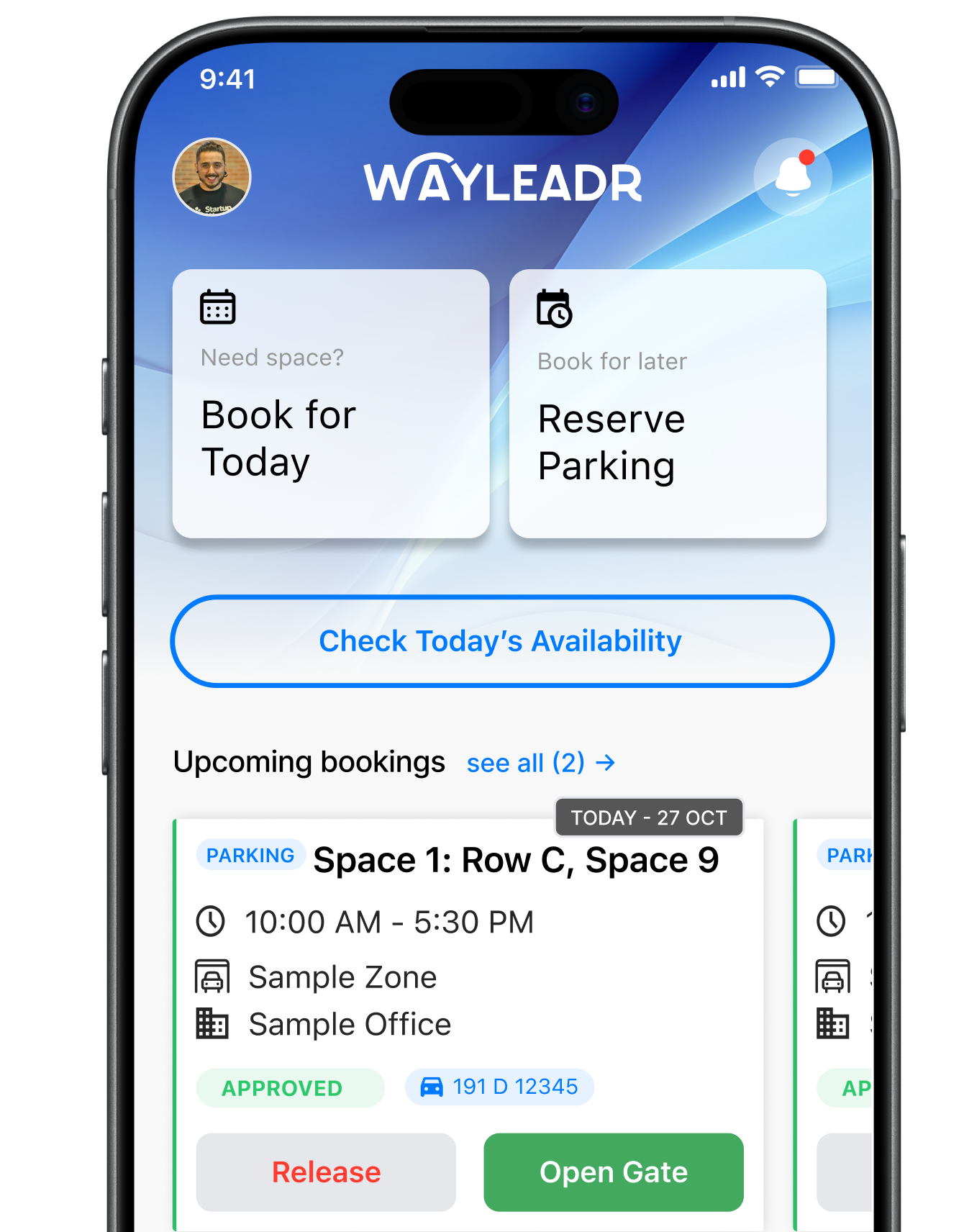 Smartphone screen displaying the Wayleadr app interface, showing parking space booking options, upcoming bookings, and buttons to release space or open the gate.