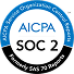 A circular AICPA SOC 2 logo with blue and black sections and the text “AICPA Service Organization Control Reports” and “Formerly SAS 70 Reports.”.